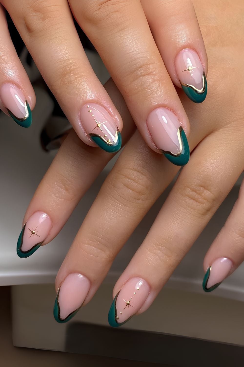 Abstract emerald green tips with gold celestial accents