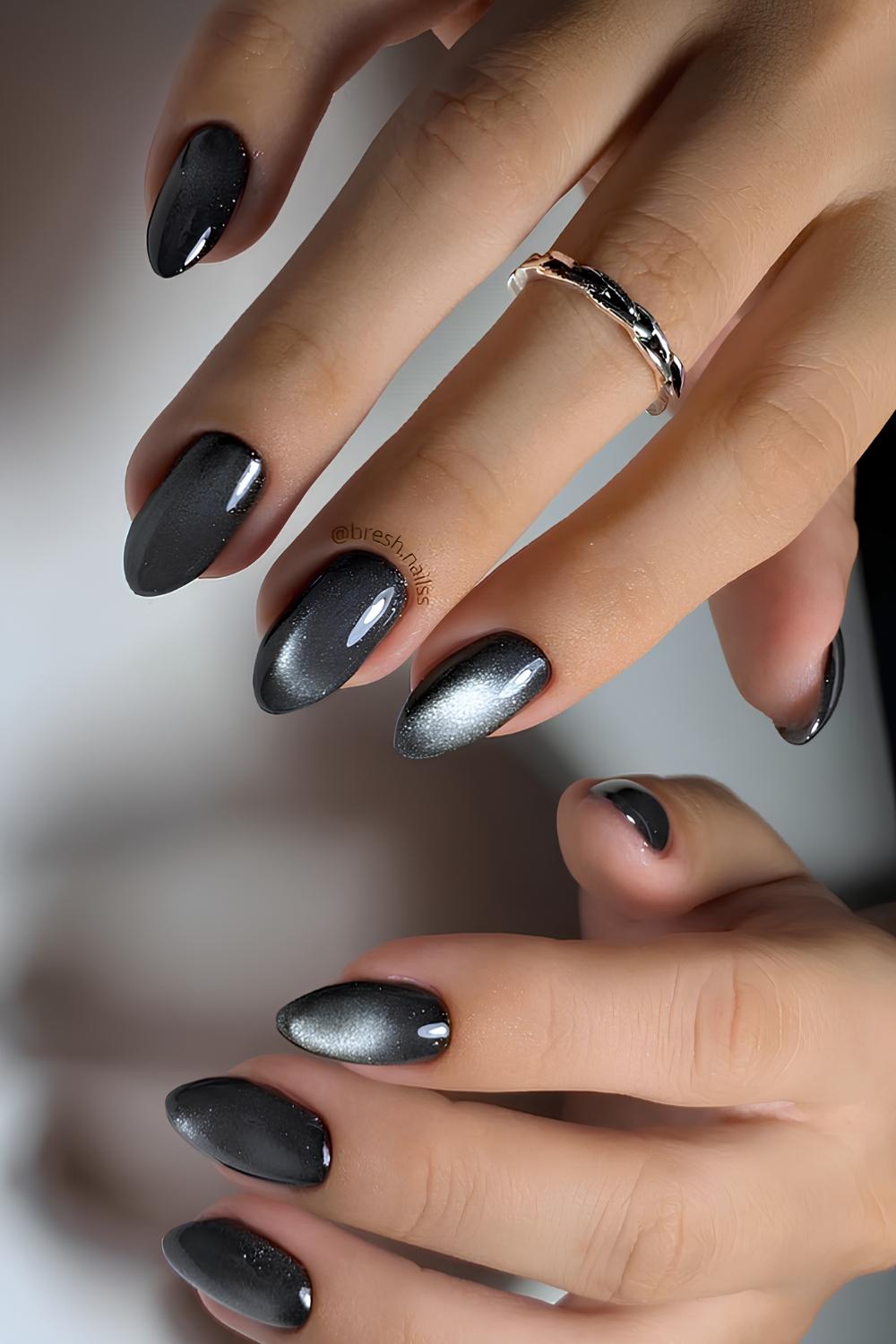 Almond shaped black cat eye nails
