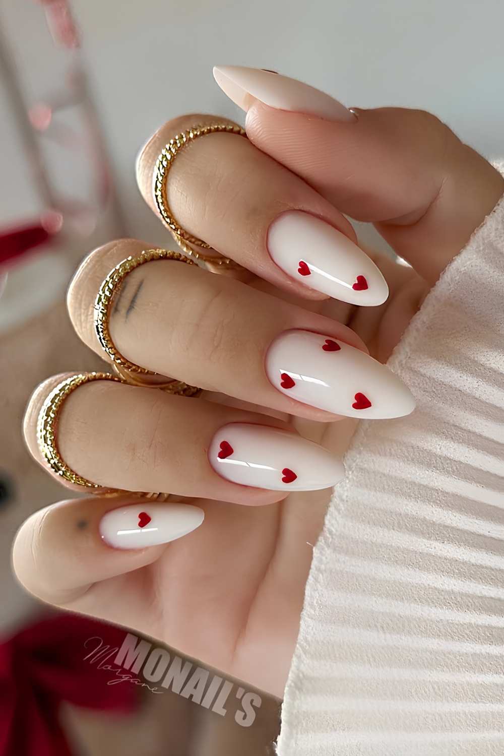 Almond white nails with red hearts