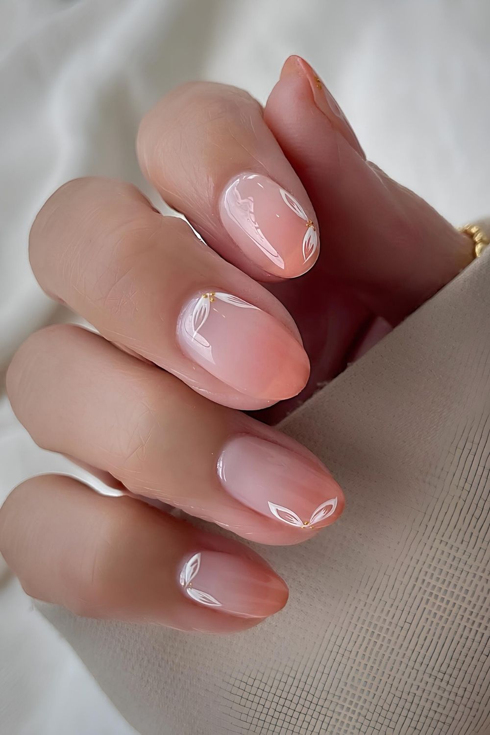 Baby coral ombre nails with floral accents