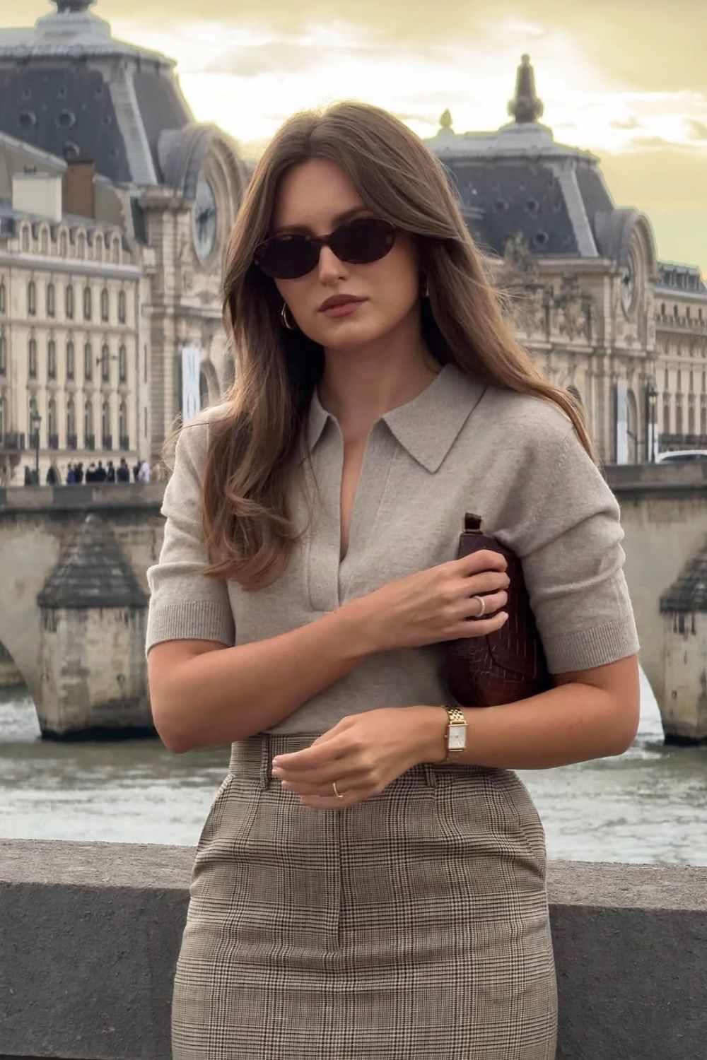 Beige knit top with plaid skirt