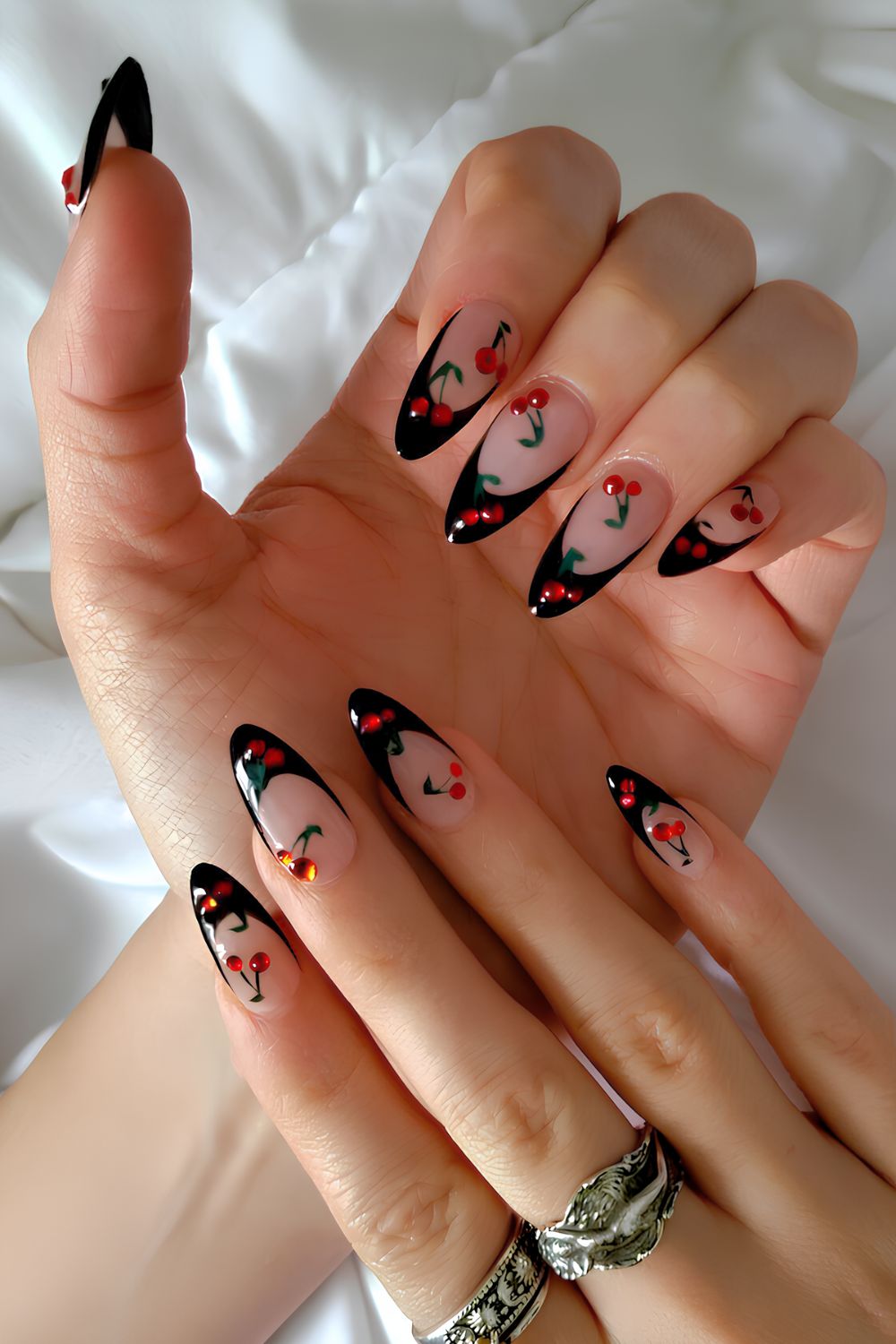 Black French mani with accent cherry art