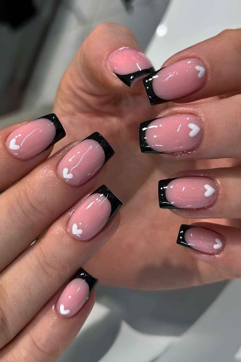 Black French mani with white cuticle hearts
