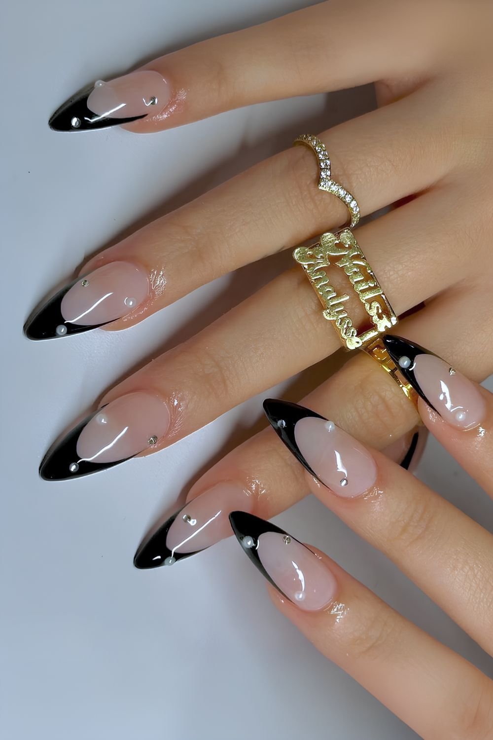 Black French nails with pearls and rhinestones
