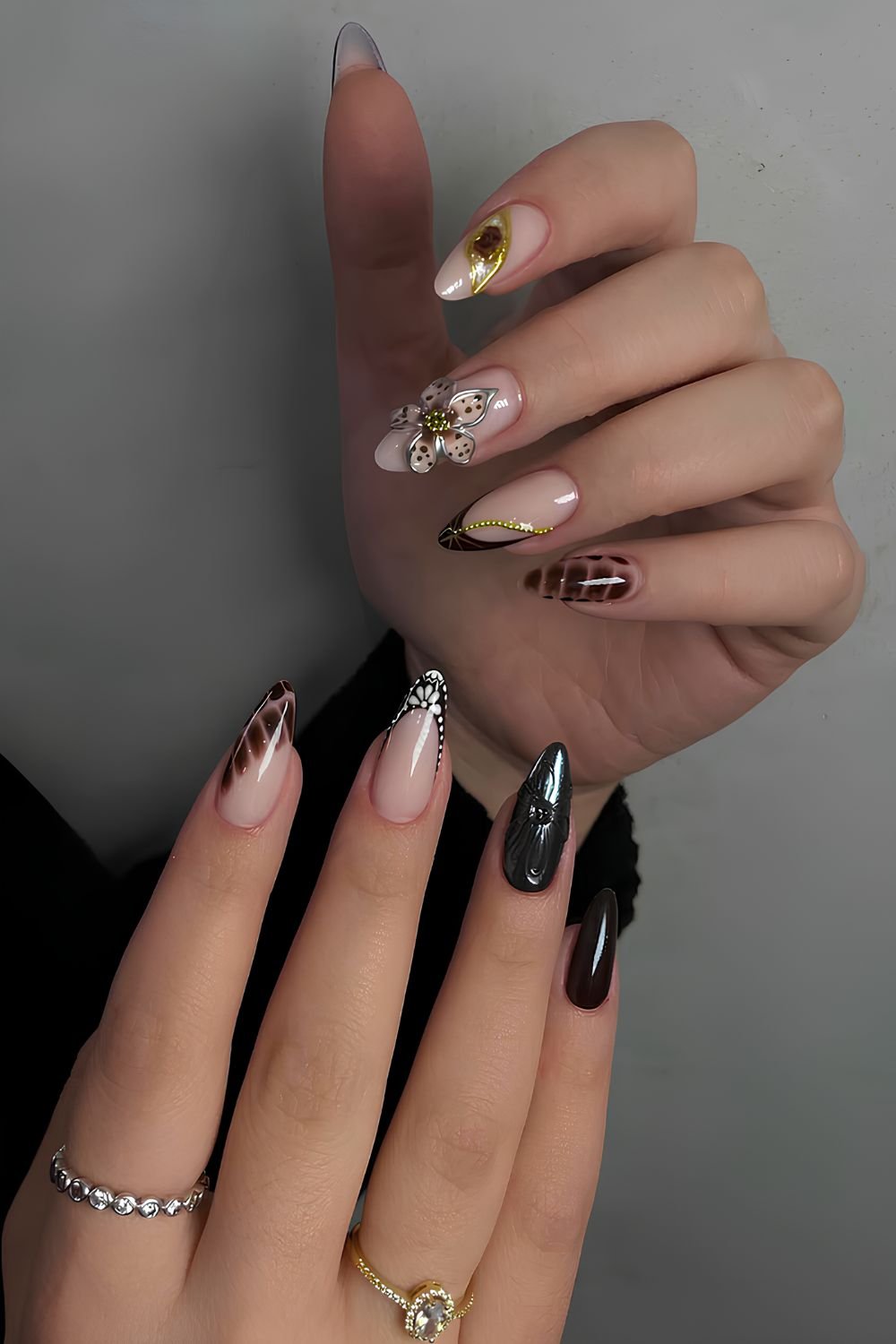 Black and brown nails with 3D flowers and animal print