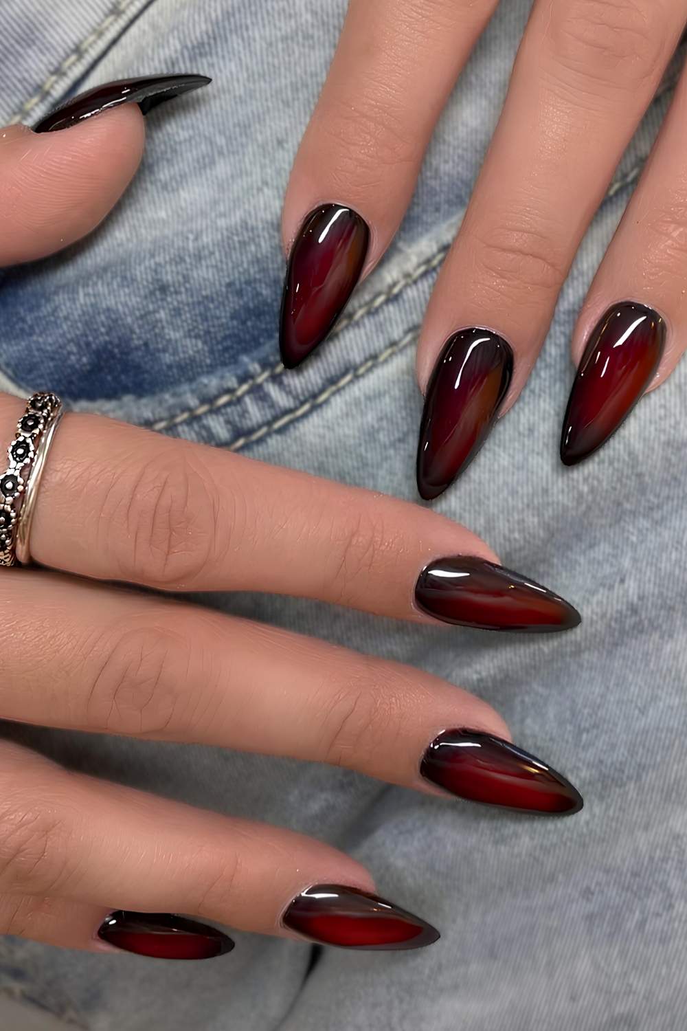 Black and cherry red aura manicure