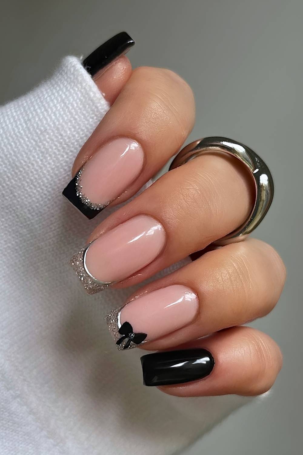 Black and gold French mani with bows