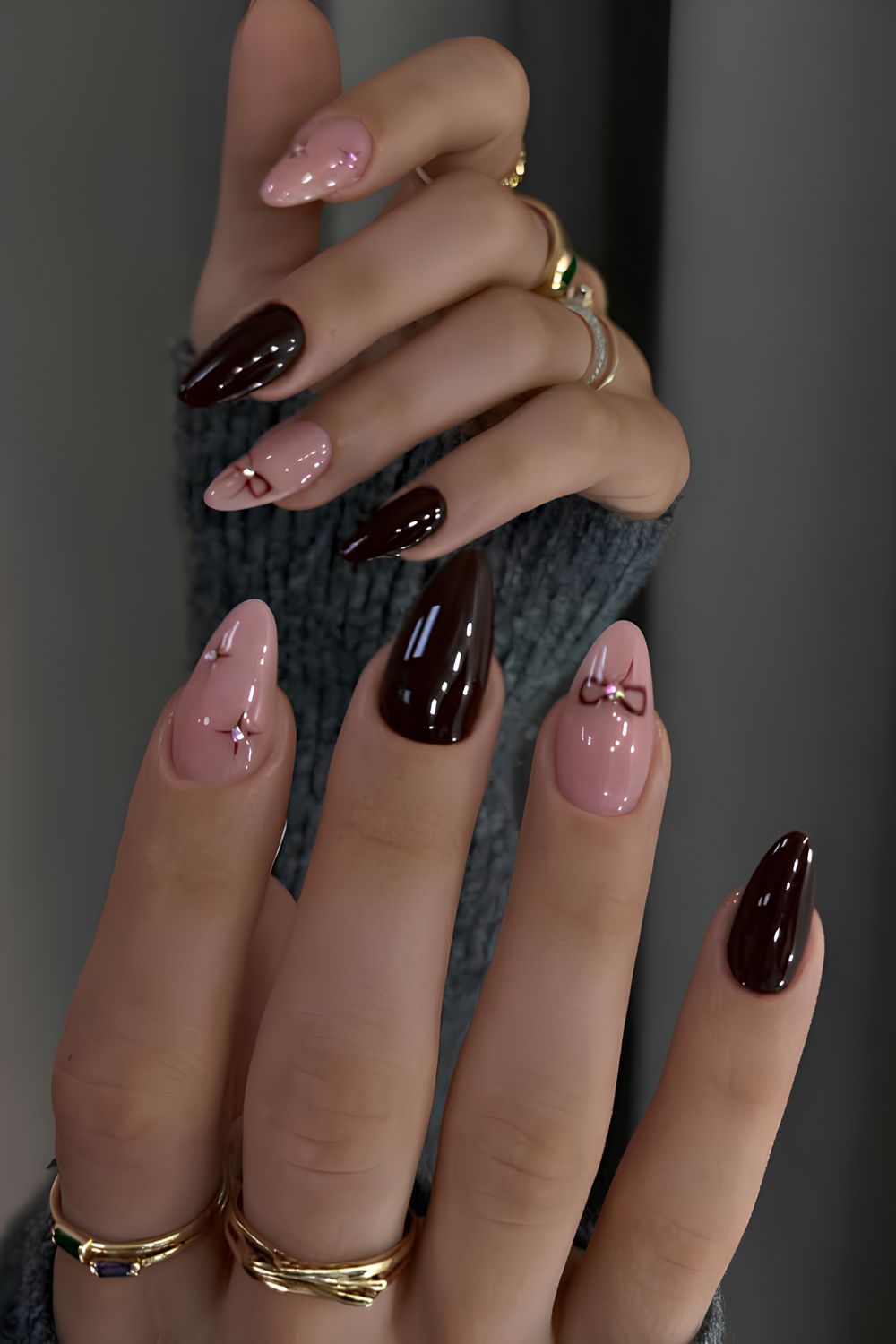 Black cherry nails with bows and rhinestones