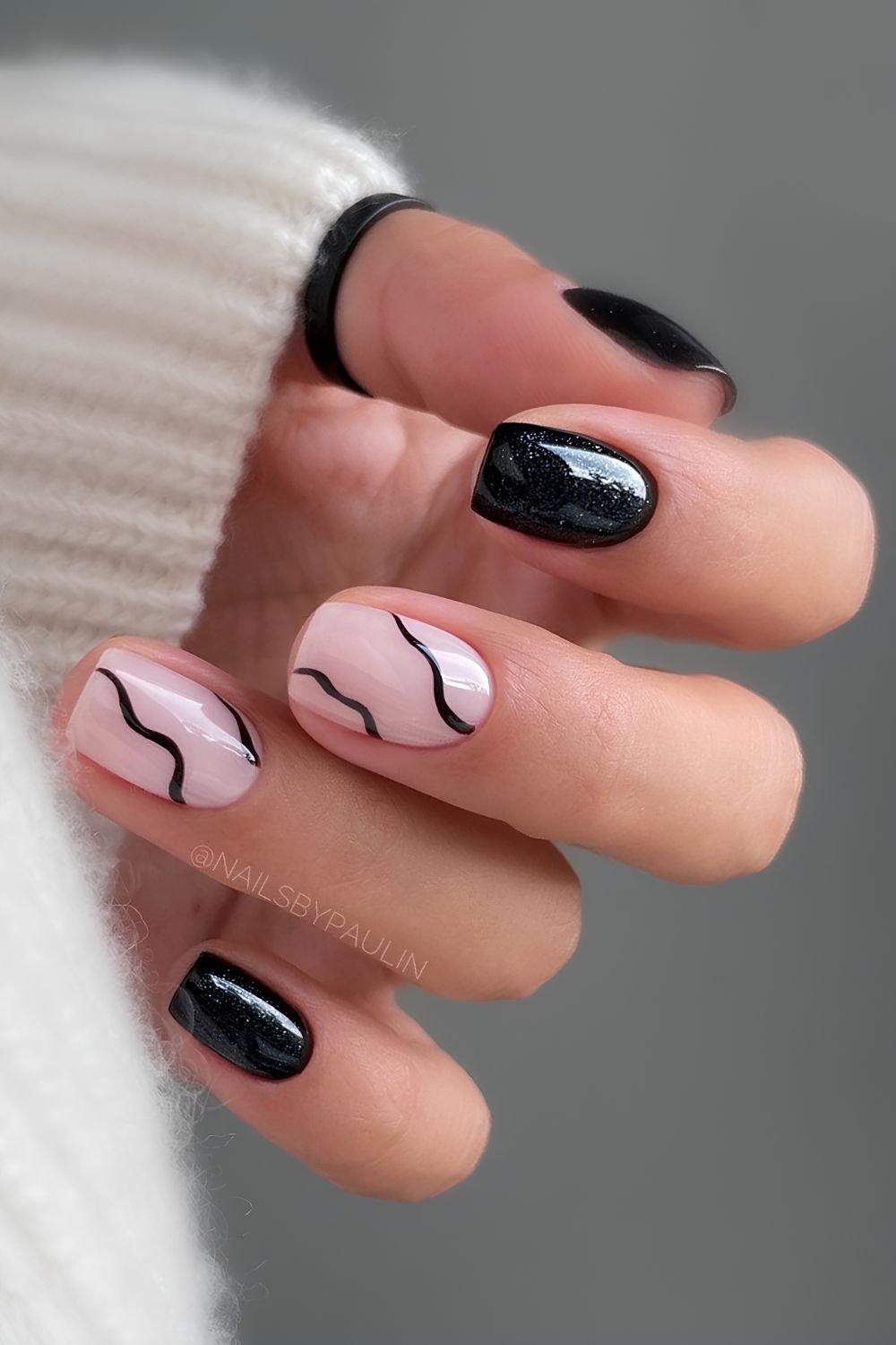 Black mani with accent swirls