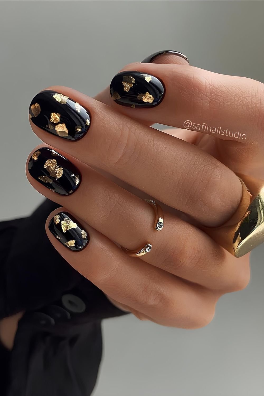 Black mani with gold foil details