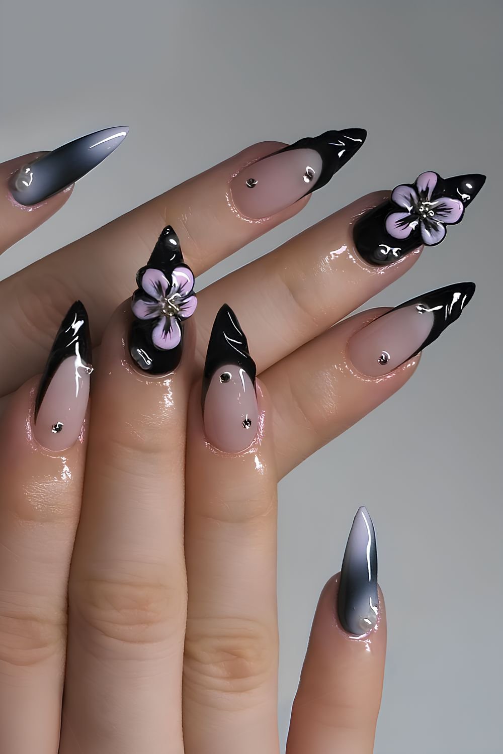 Black manicure with 3D flower details