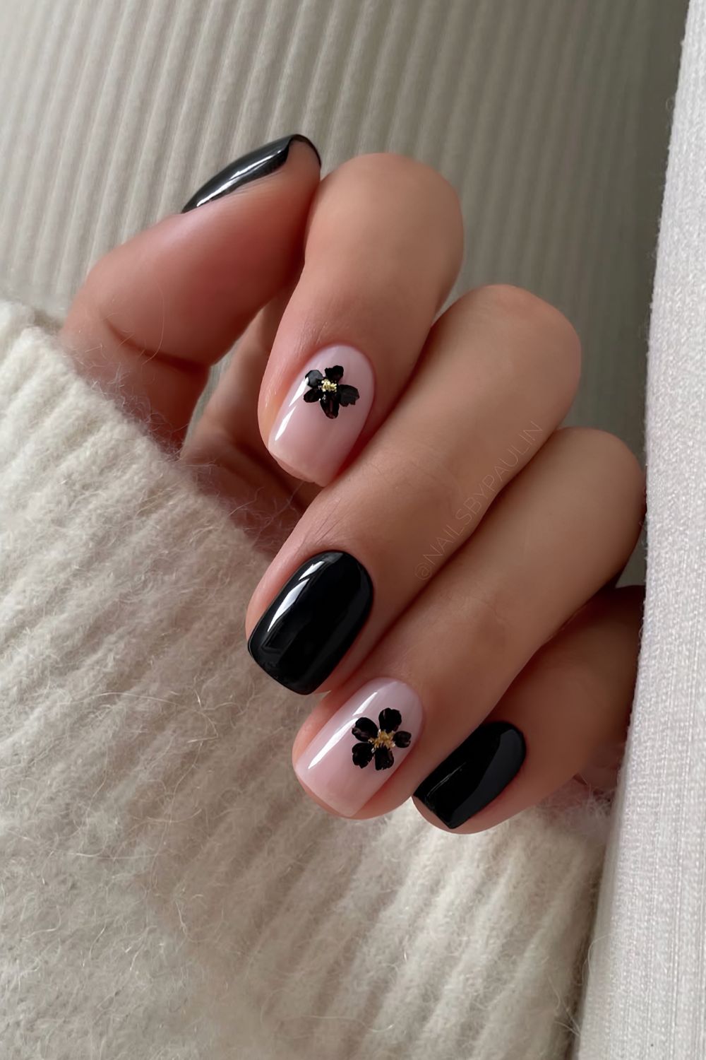 Black nails with artsy floral details
