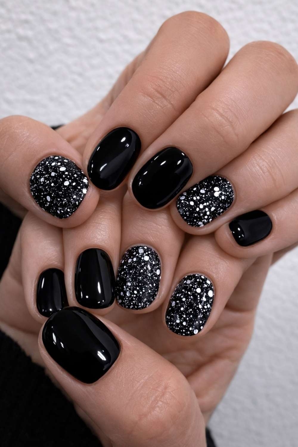 Black nails with chunky silver glitter