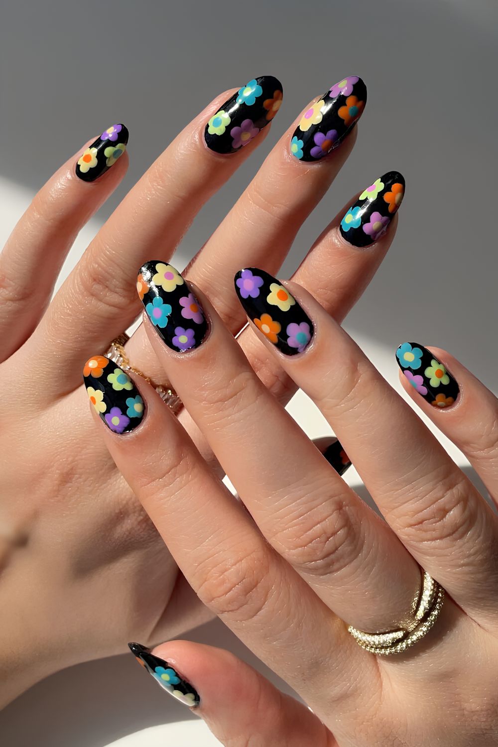 Black nails with colorful flower art