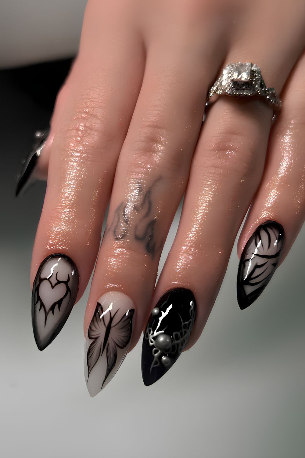 Black nails with hearts and butterflies