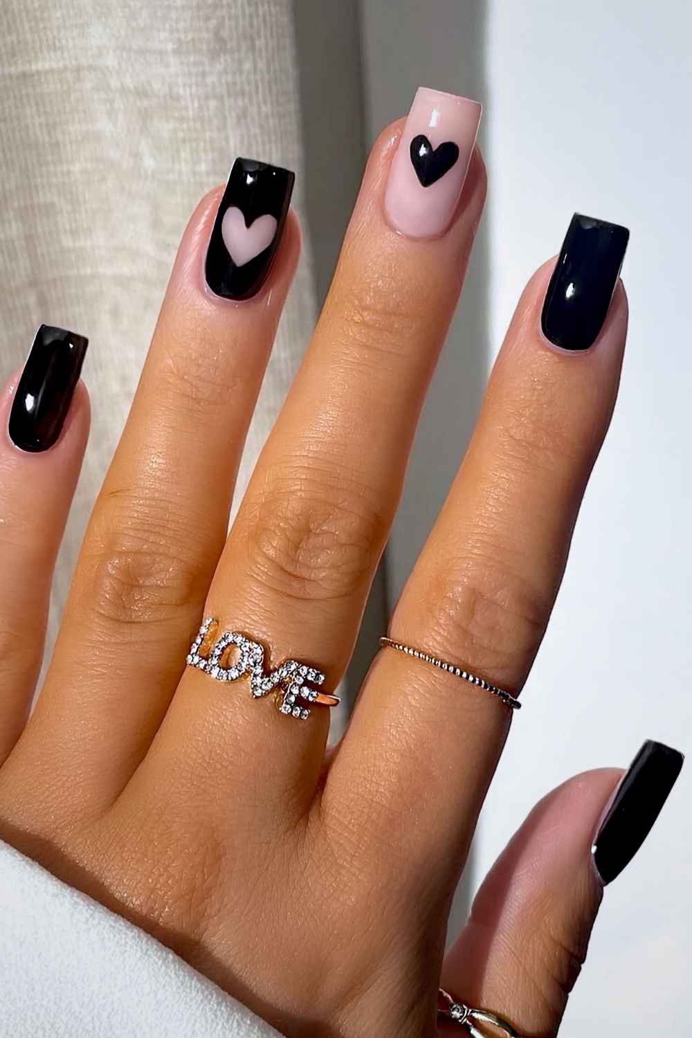 Black square manicure with hearts