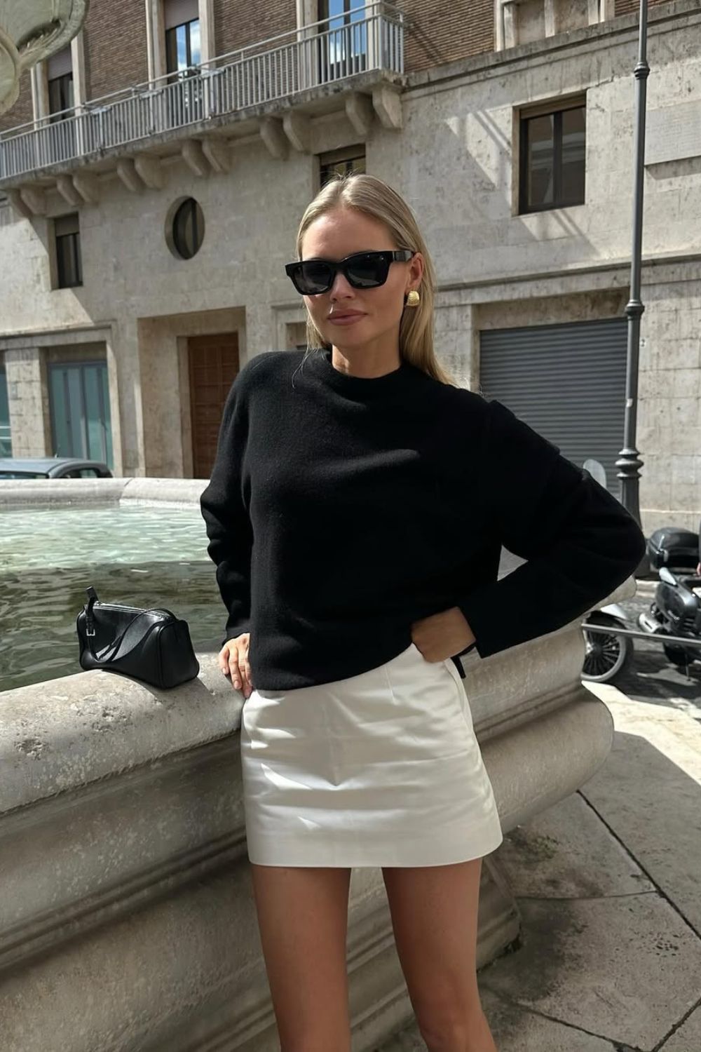Black sweater with white mini skirt