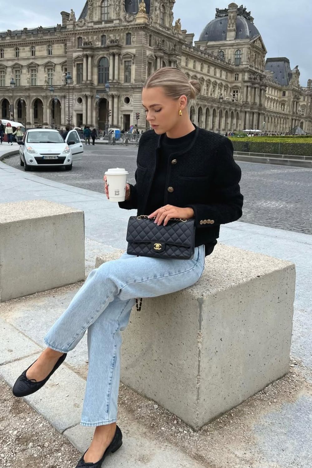 Black tweed jacket and light wash jeans and ballets