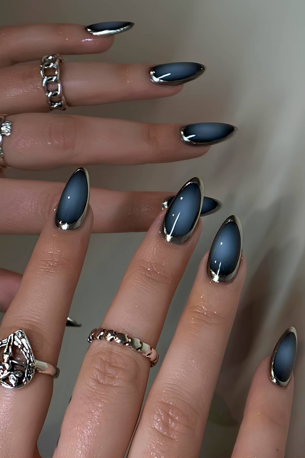 Blue and black aura nails with silver accents