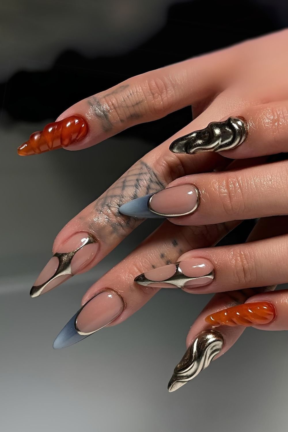 Blue and orange mani with silver accents