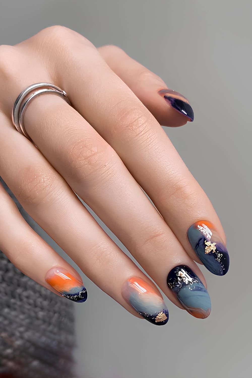 Blue and orange marble mani