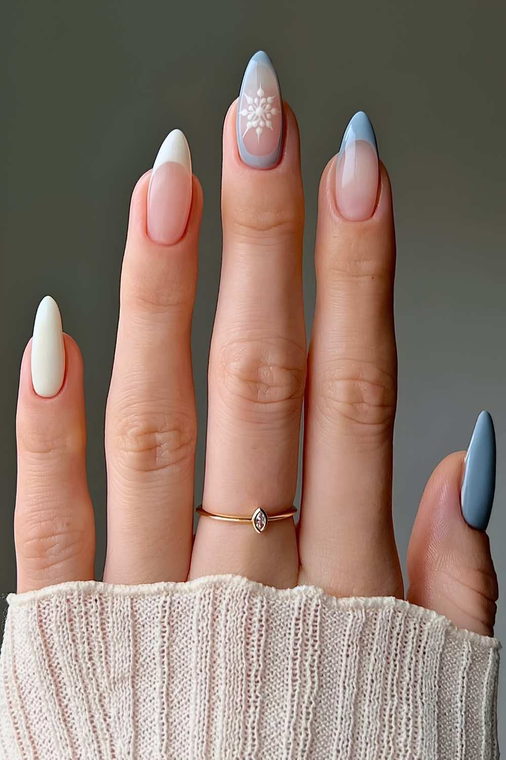 Blue and vanilla nails with snowflake art