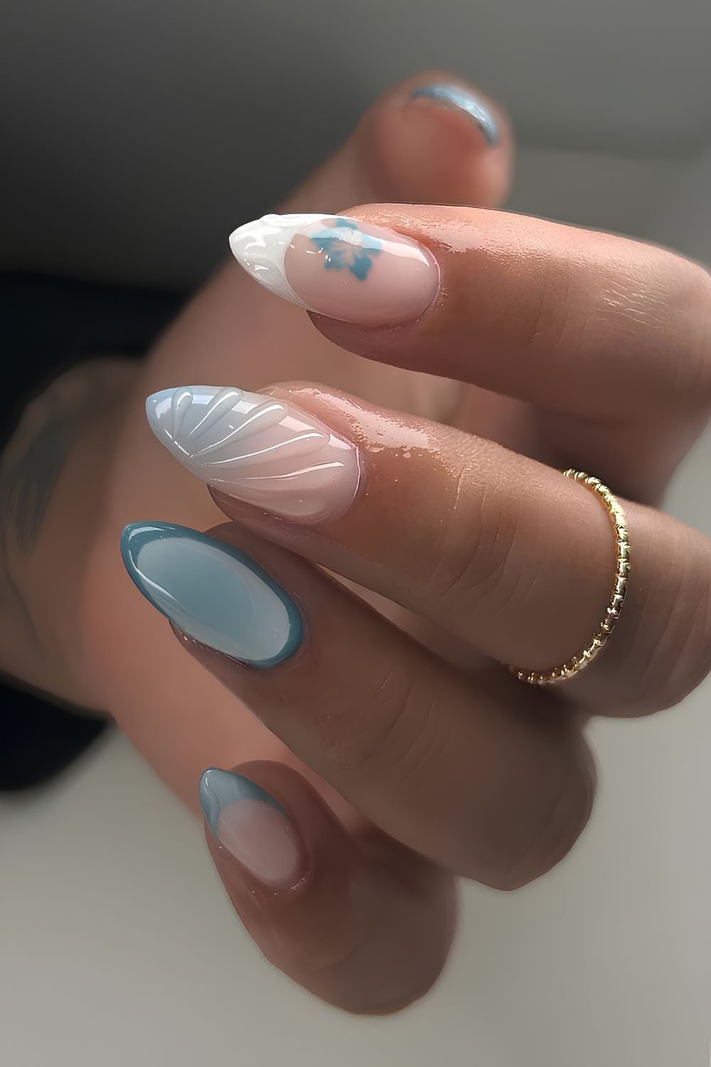 Blue and white beachy nails with raised shell art