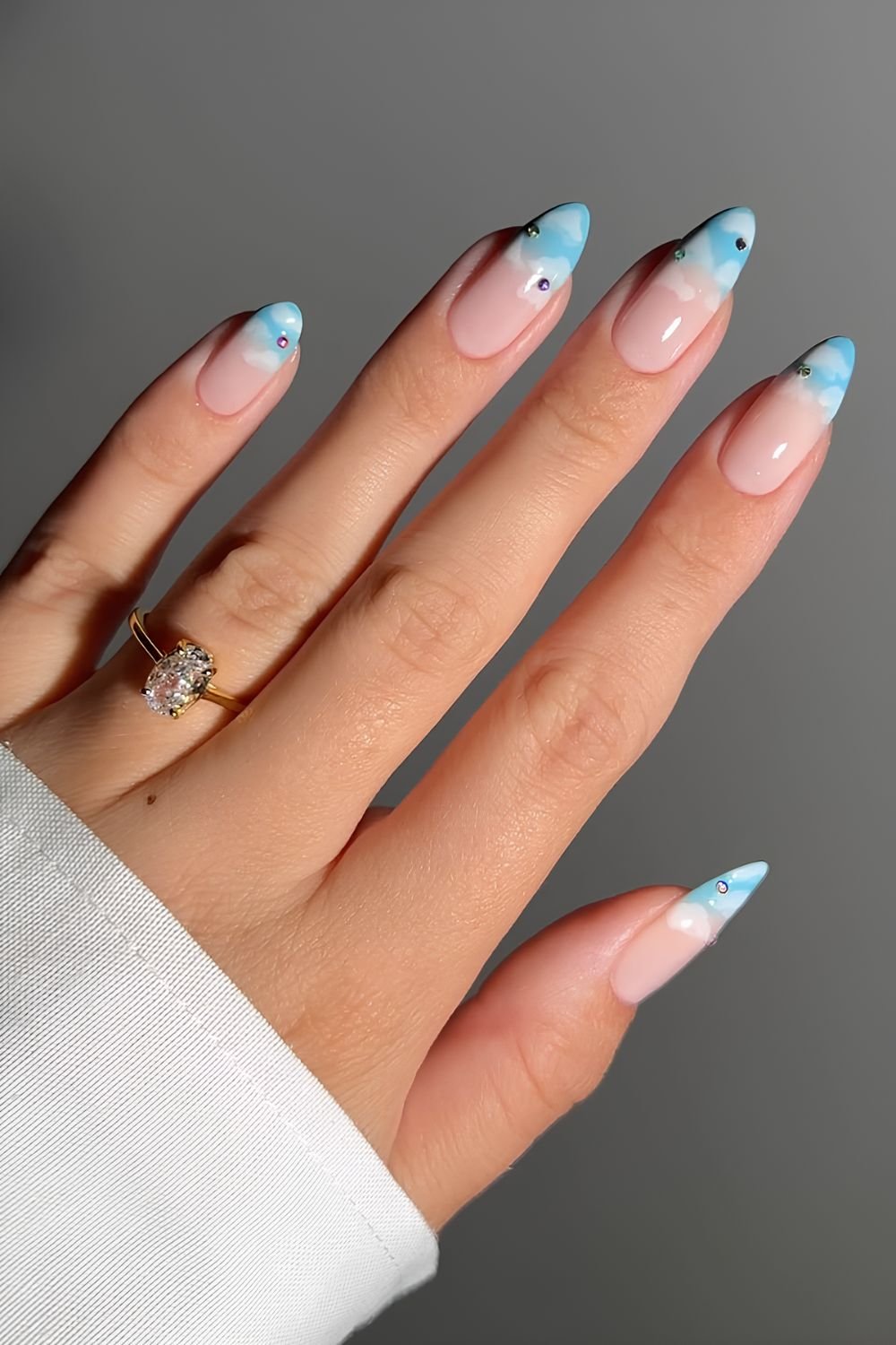 Blue and white cloud nails with gems