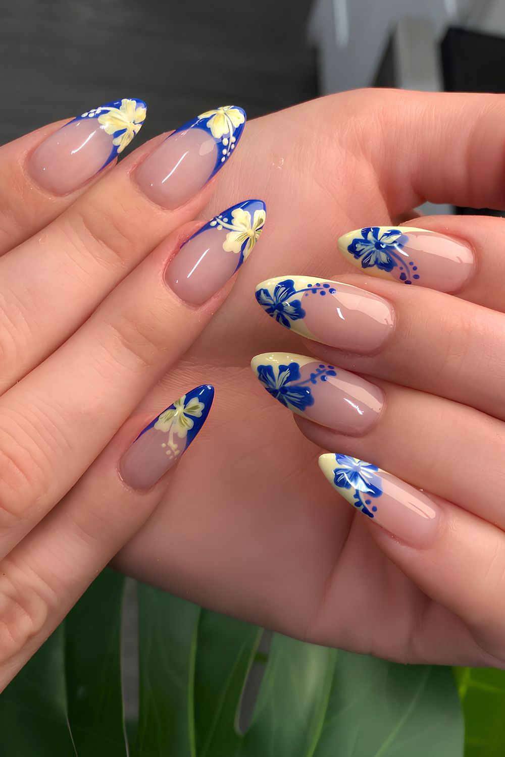Blue and yellow French nails with hibiscus flowers