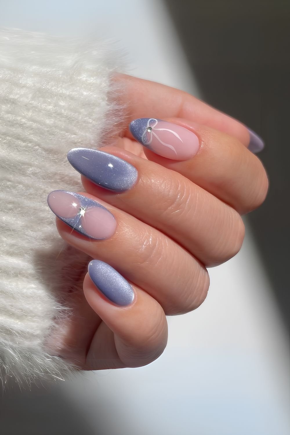 Blue cat eye nails with bows