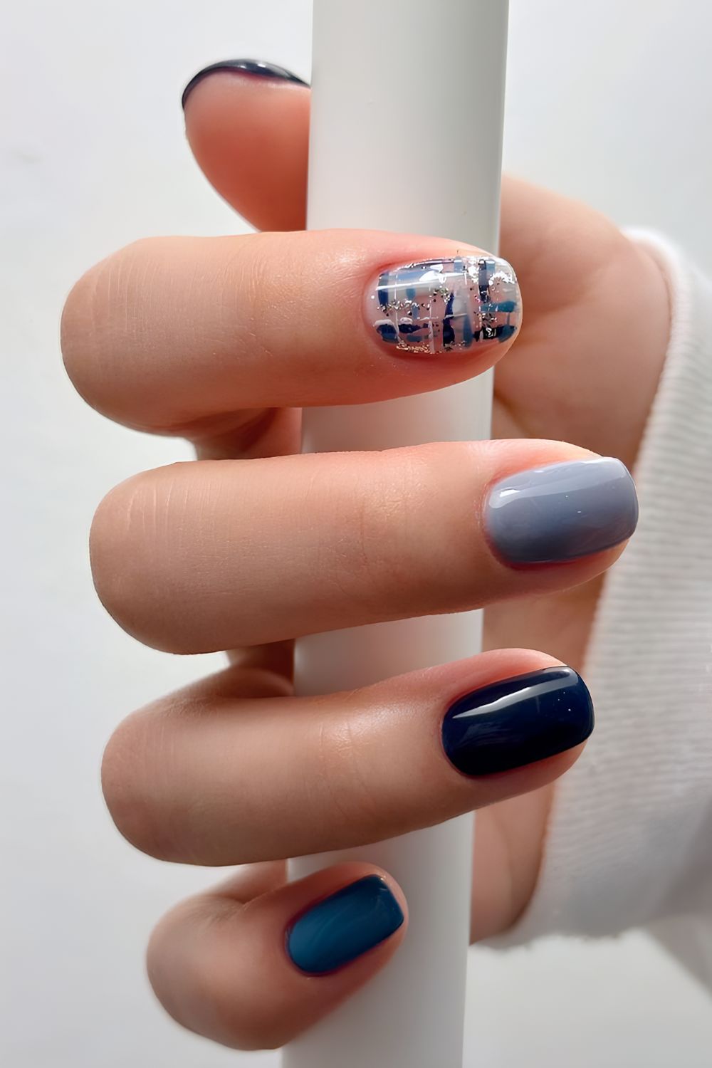 Blue manicure with boucle-inspired art