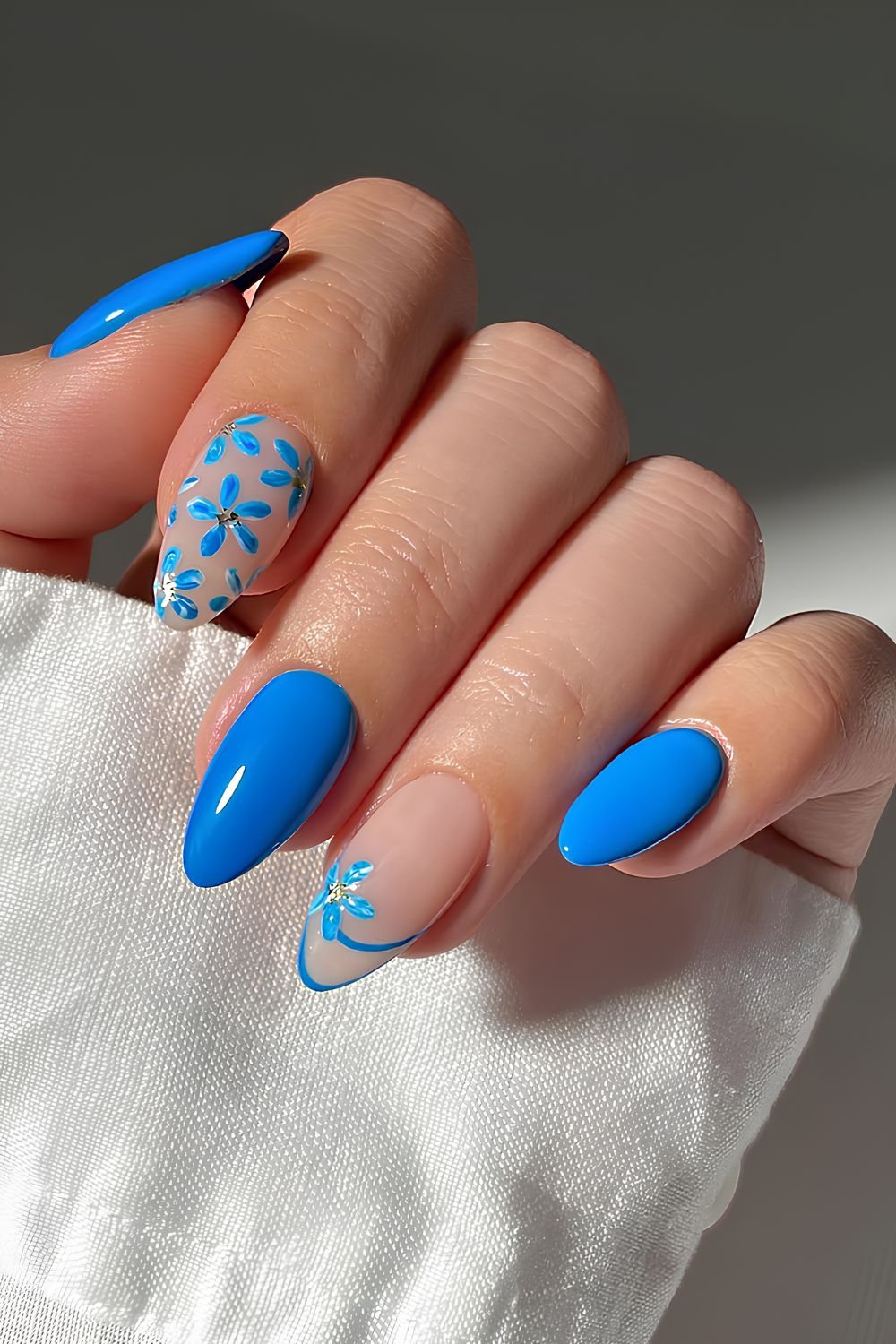Blue nails with floral accent and double line tip