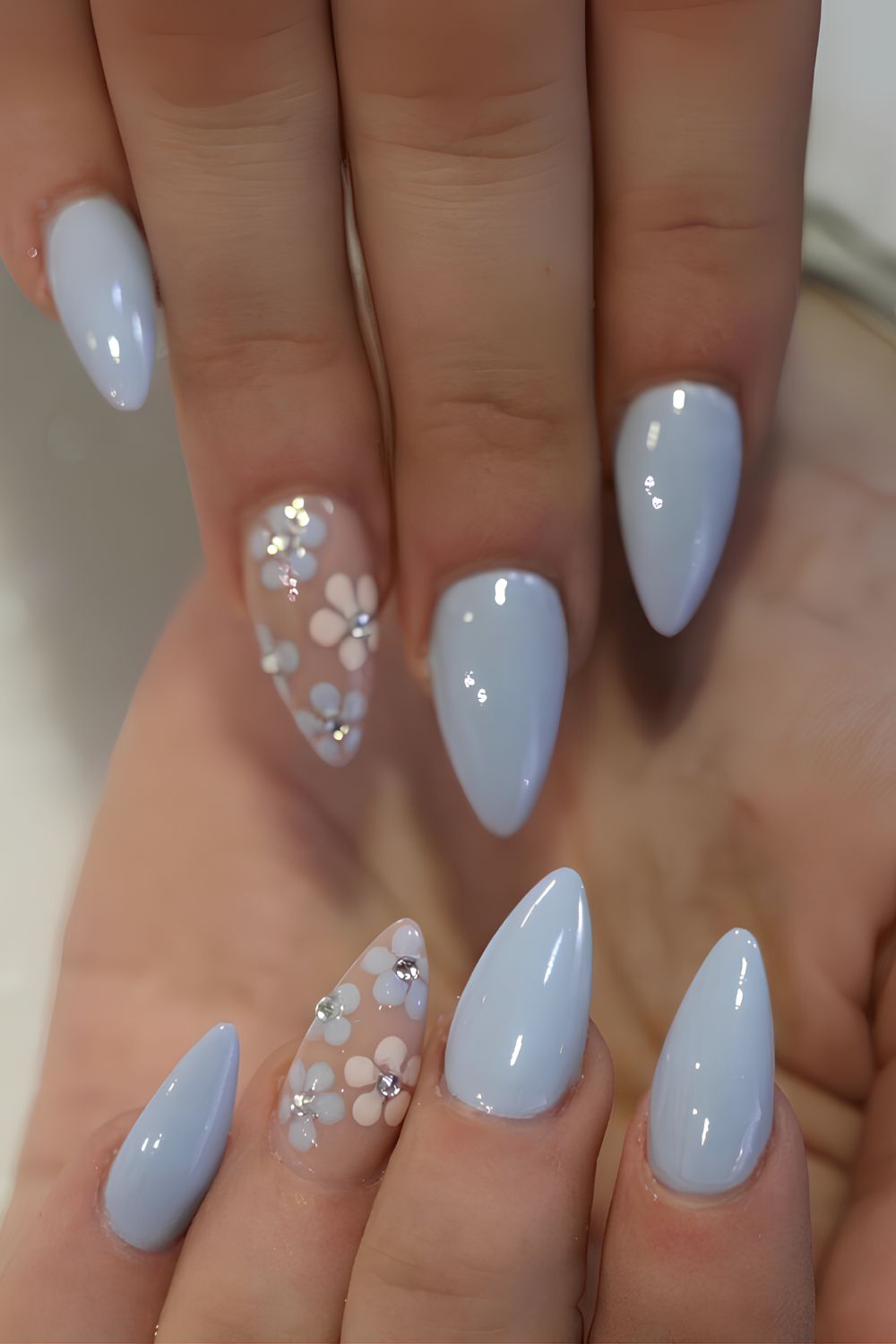 Blue nails with florals and rhinestones