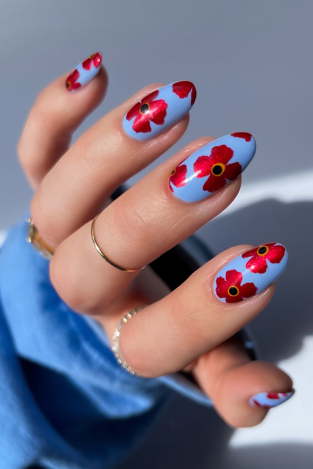 Blue nails with red poppy flower art