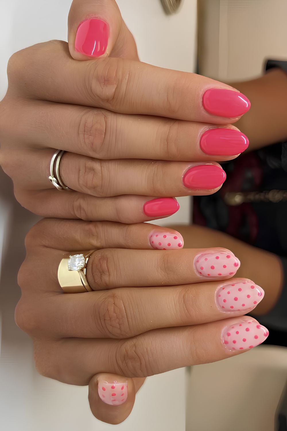 Bright and light pink nails with polka dots