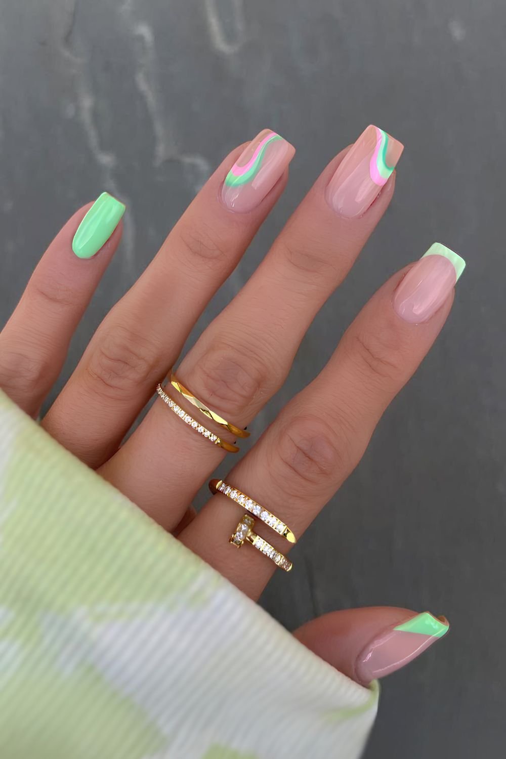 Bright green nails with funky swirls