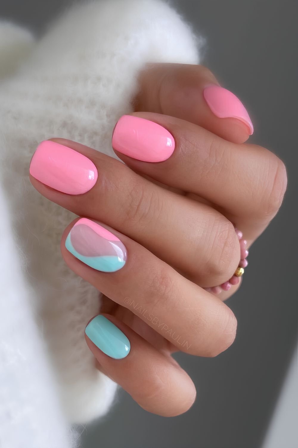 Bright pink and blue mani with negative space accent