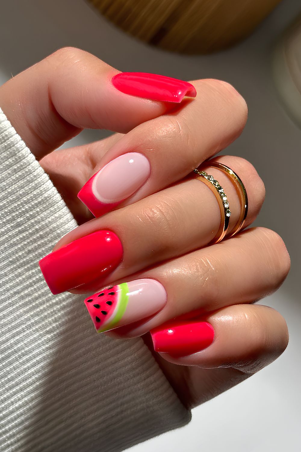 Bright red manicure with watermelon art
