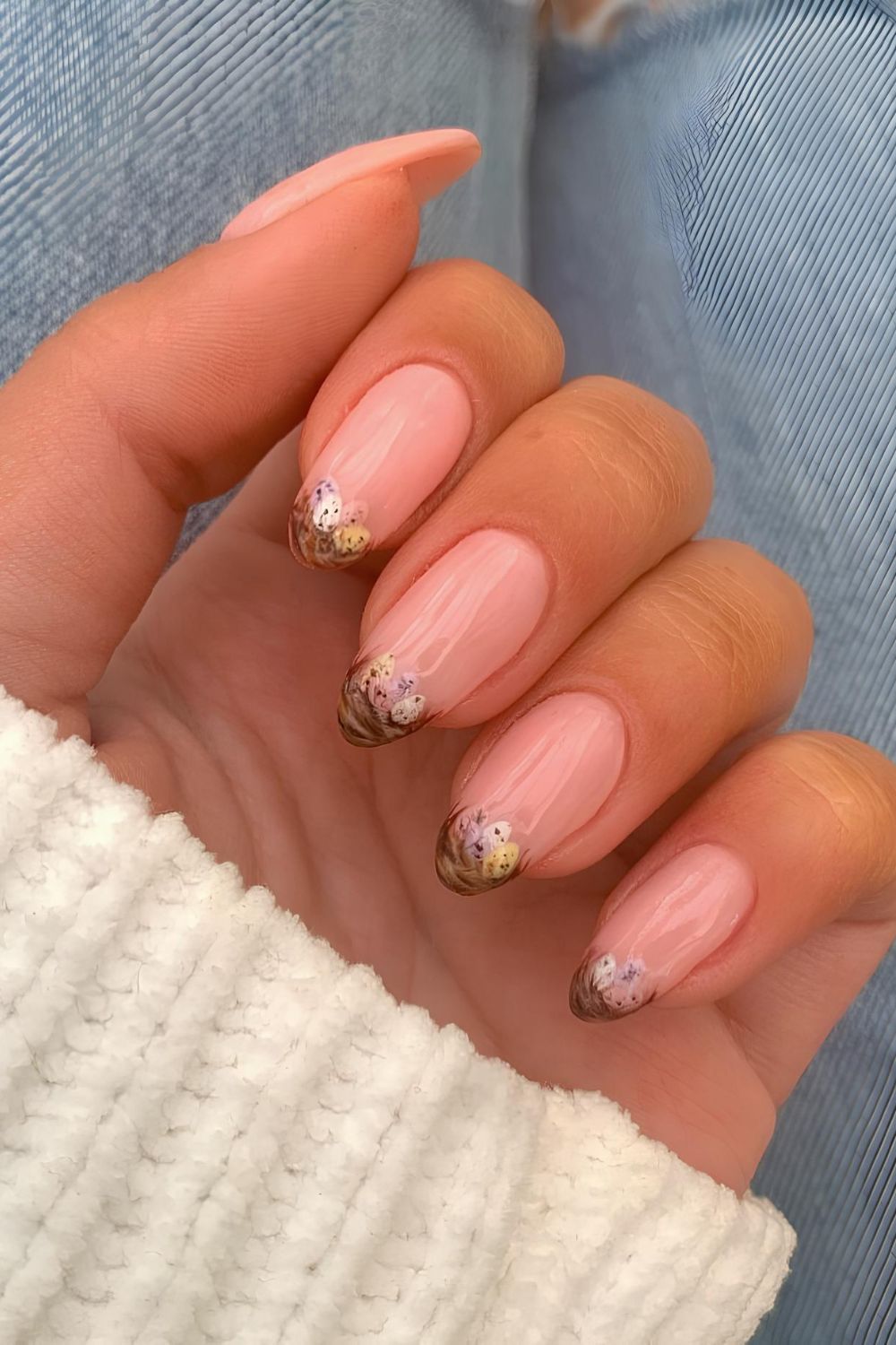 Brown French nails in nest with mini eggs design