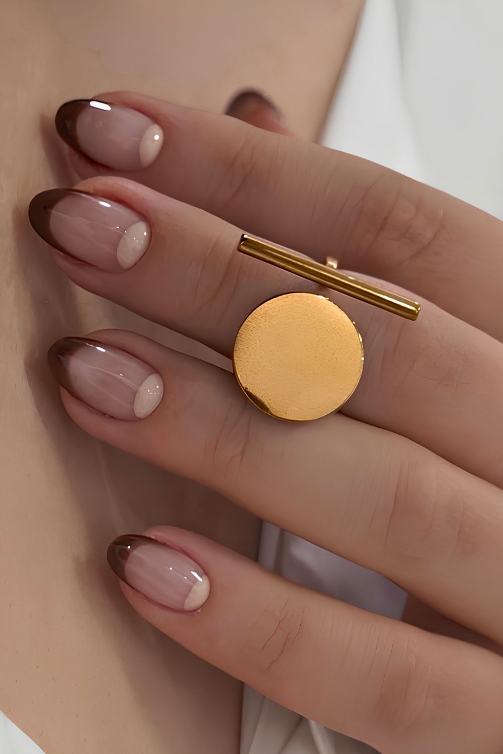 Brown French nails with half-moon art