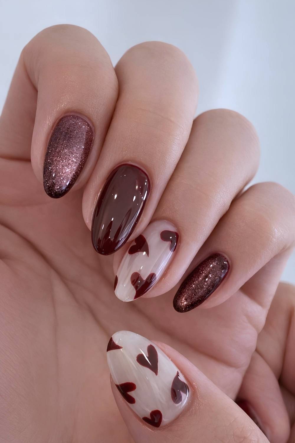 Brown and white mani with accent hearts