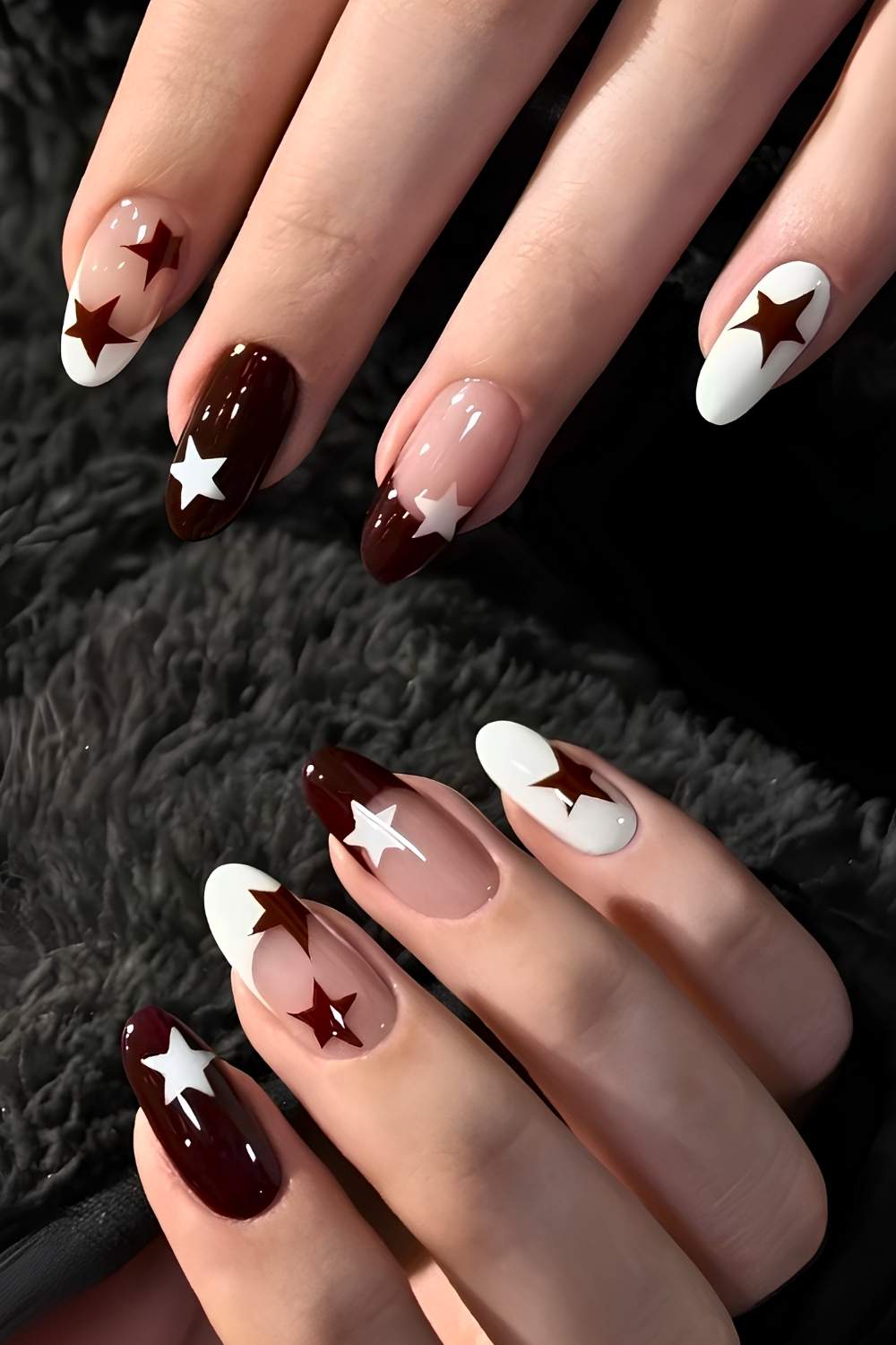 Brown and white nails with accent star art
