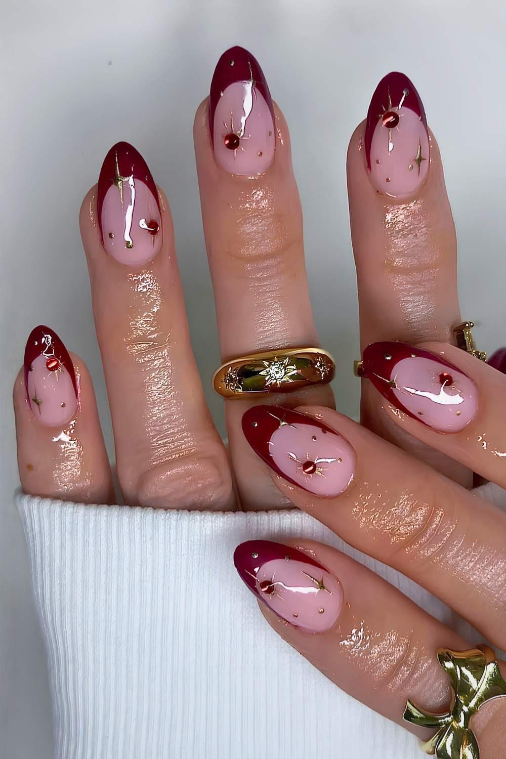 Burgundy French nails with sparkly celestial art