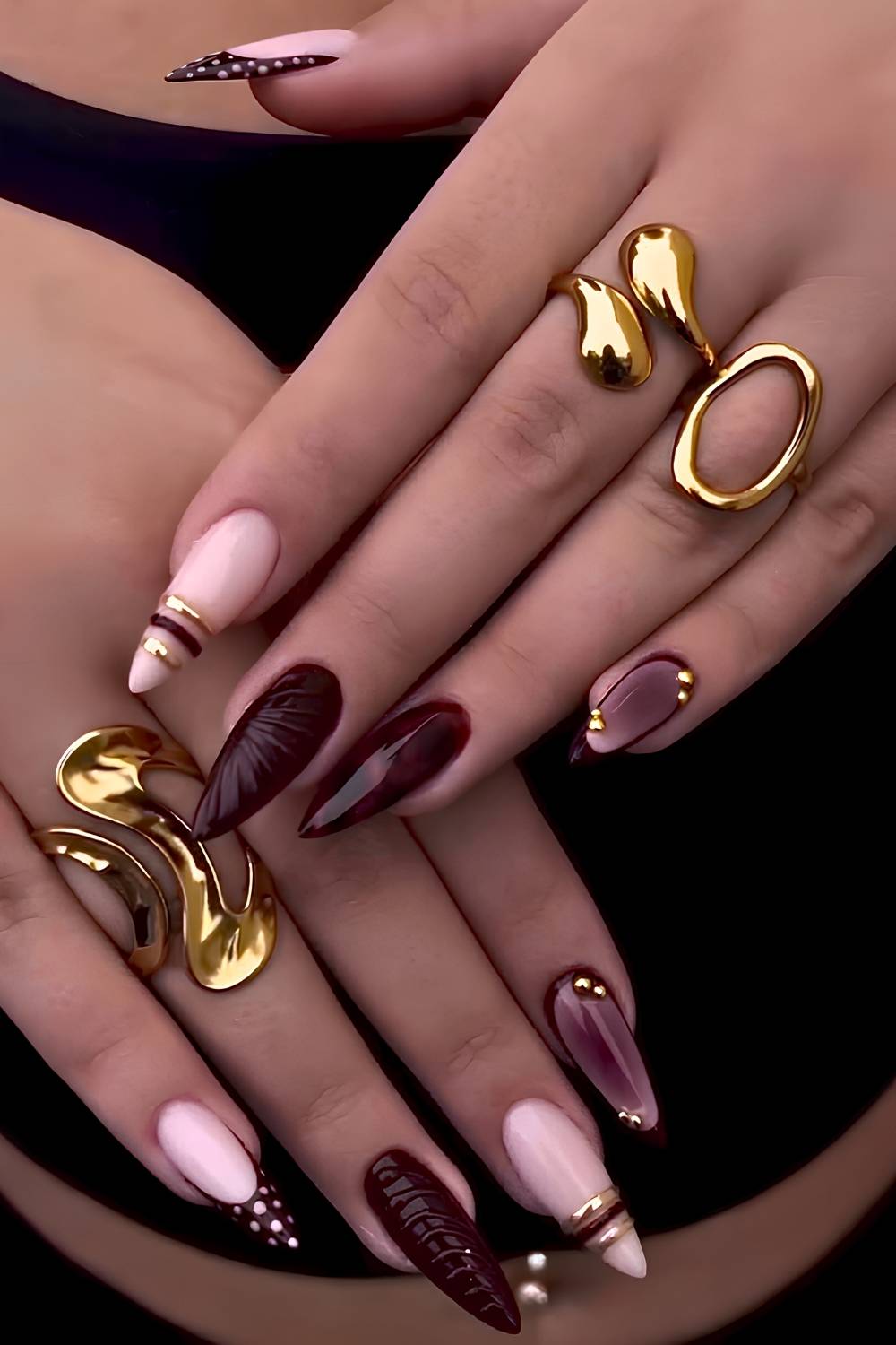 Burgundy and gold bangle nails