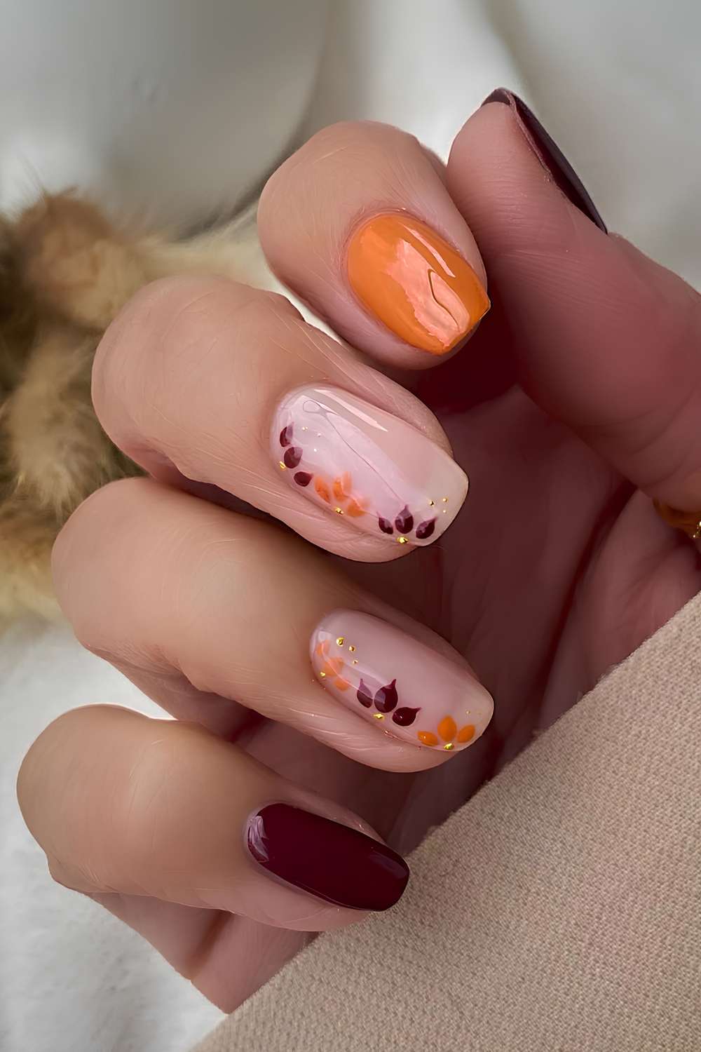 Burgundy and orange fall floral manicure