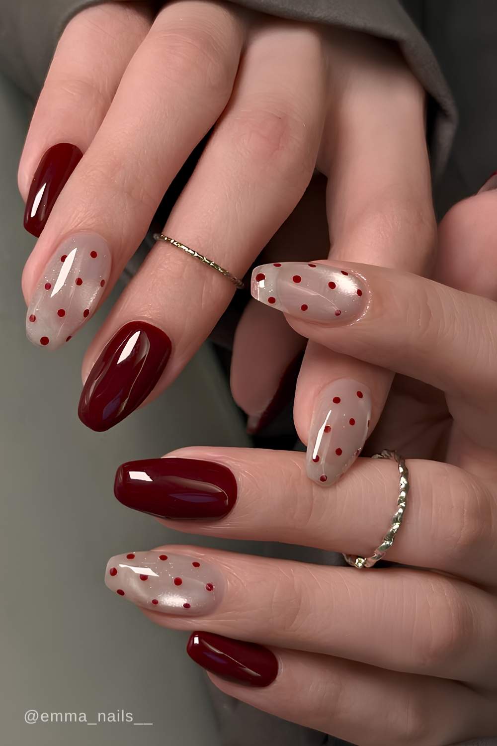 Burgundy nails with cat eye and polka dot accents
