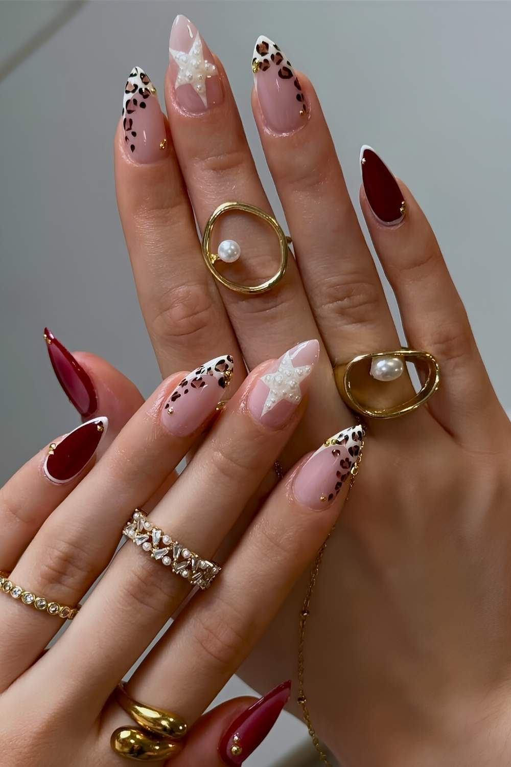 Burgundy nails with stars and animal print