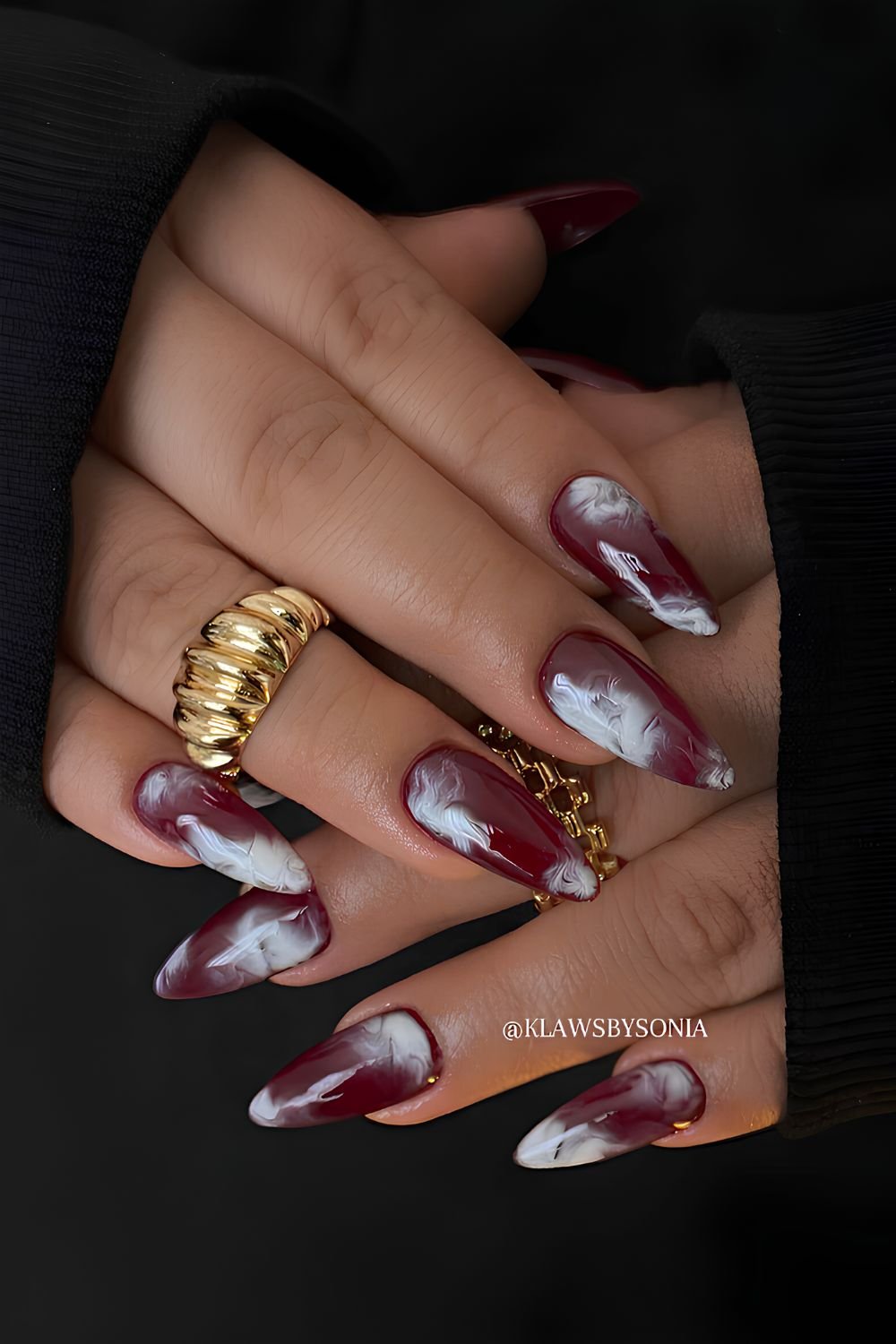 Burgundy nails with white marble swirls