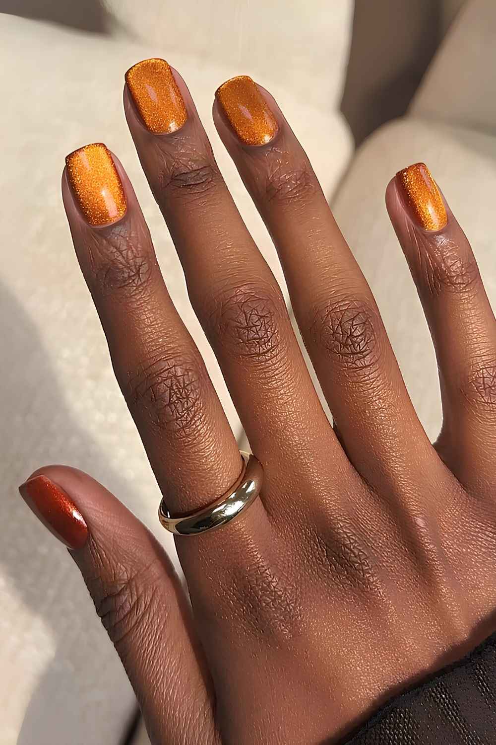 Burnt orange cat eye manicure