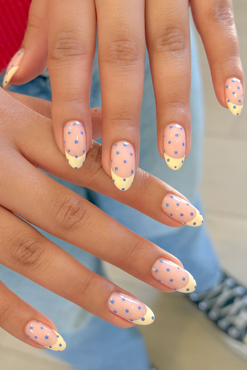 Butter yellow French nails with blue dots